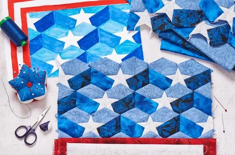 Sewing of quilt with stylized elements of American flag Stock Photos