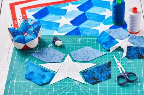 Sewing of quilt with stylized elements of American flag Stock-Fotos