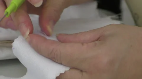 Sewing - Removing Seam from White Fabric Stock Footage 140937510