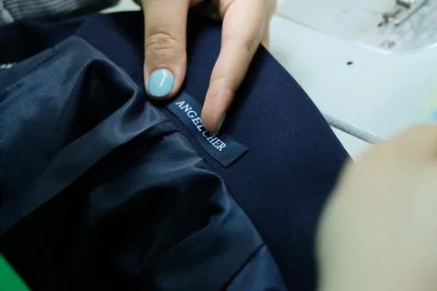 Sewing school uniforms Stock Photos