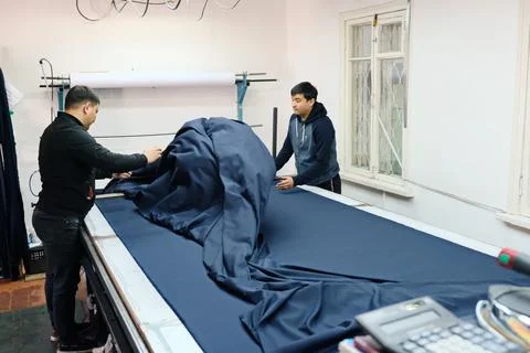 Sewing school uniforms 스톡 사진