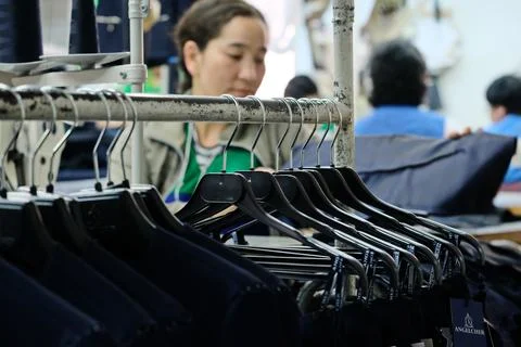 Sewing school uniforms Stock Photos
