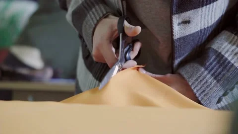 Sewing scissors cutting fabric. Pattern making process. Video stock 209185892