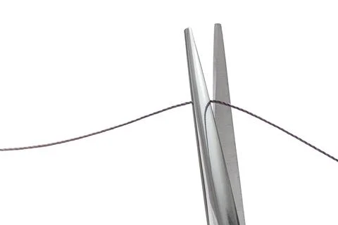 Sewing scissors cutting thread on white isolated Stock Photos