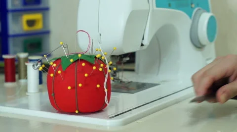 Sewing Scissors Down and Picking Up Needle Stock Footage 64736677