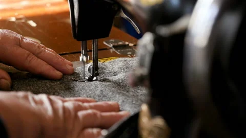 Sewing on a sewing machine. Close-up. Women's hands Stock Footage 89090917
