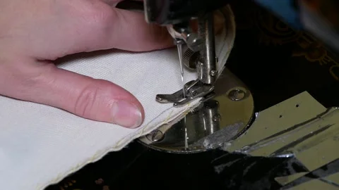 Sewing on a sewing machine. Clouse up. Stock Footage 166702817