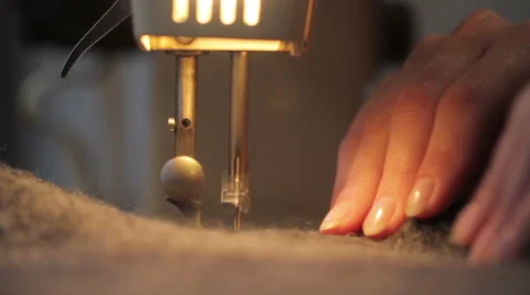 Sewing with a sewing machine. Stock Footage 60747388