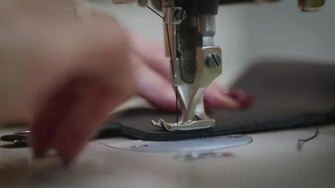 Sewing on a sewing machine Stock Footage 266139637