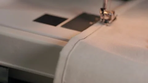 Sewing a simple stitching line on natural linen fabric Stock Footage 345456563