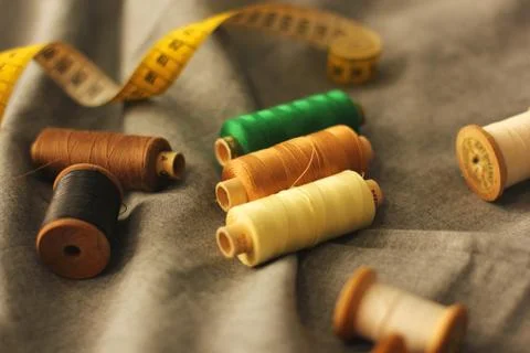 Sewing. Spools of thread on the fabric. Threads. Meter Stock Photos