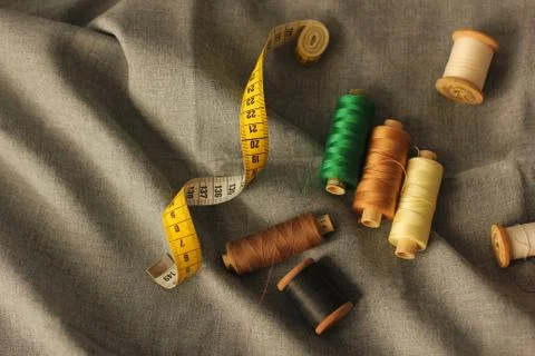 Sewing. Spools of thread on the fabric. Threads. Meter Stock Photos