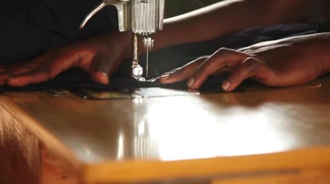 Sewing with sunlight Vídeos de archivo 50585142