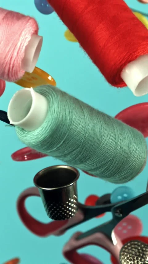 Sewing supplies fly on a blue background. Filmed on a high-speed camera at 1000 Stock Footage 335384259