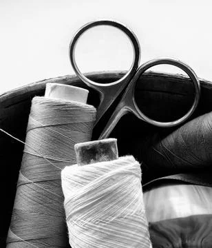 Sewing supplies. spools of thread and scissors. black and white Stock Photos