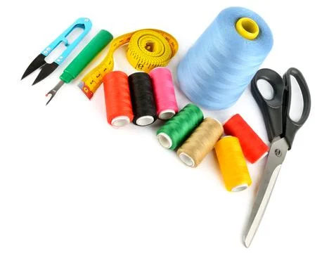 Sewing supplies (thread, scissors and measuring tape) isolated on a white. .. Stock-Fotos