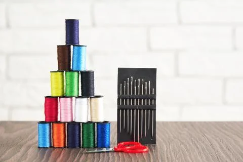 Sewing supplies, threads, scissors and needles Stock Photos