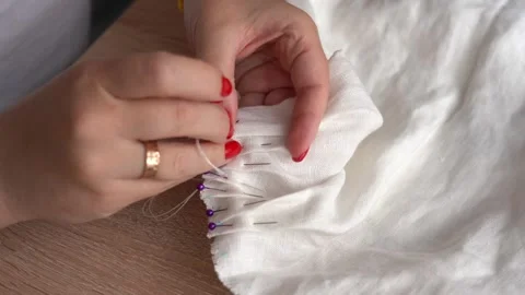 Sewing techniques for beginners in home crafting with fabric and pins Video stock 310171799
