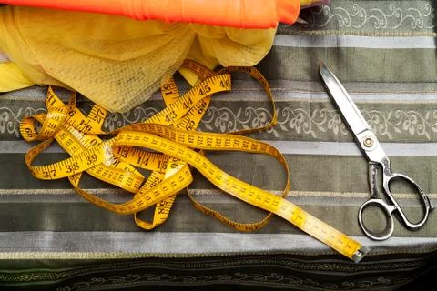 Sewing textile or cloth. Work table of a tailor Stock Photos