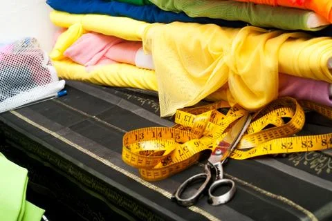 Sewing textile or cloth. Work table of a tailor Stock Photos