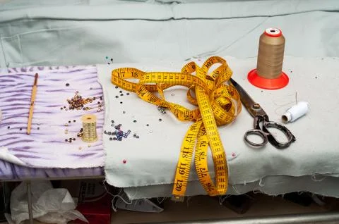 Sewing textile or cloth. Work table of a tailor Stock Photos