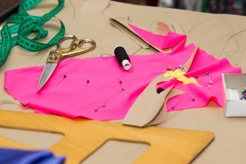 Sewing textile or cloth. Work table of a tailor Stock Photos