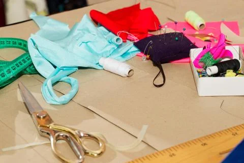 Sewing textile or cloth. Work table of a tailor Stock Photos
