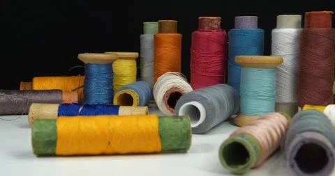 Sewing. Textile production. Many coloured  spools of threads Stock Footage 321971263