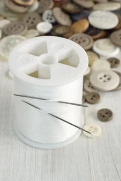 Sewing thread and needles Stock Photos