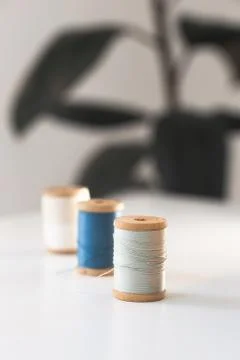 Sewing thread blue on sewing workplace Stock Photos