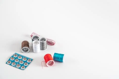 Sewing thread bobbins on the white background. Closeup. Stock-Fotos