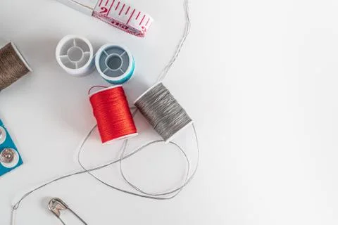 Sewing thread bobbins on the white background. Closeup. Stock-Fotos