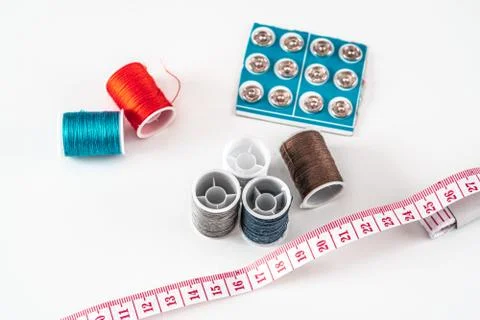 Sewing thread bobbins on the white background. Closeup. Stock-Fotos