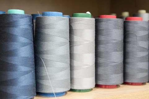 Sewing thread cones closeup Stock Photos