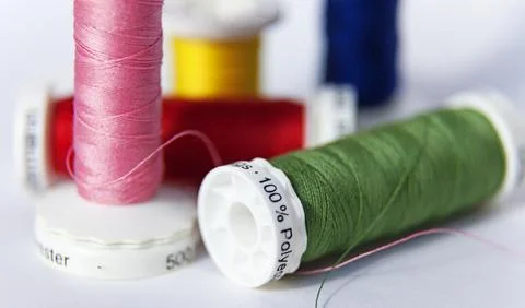 Sewing thread in different colors and 100 percent polyester Stock Photos