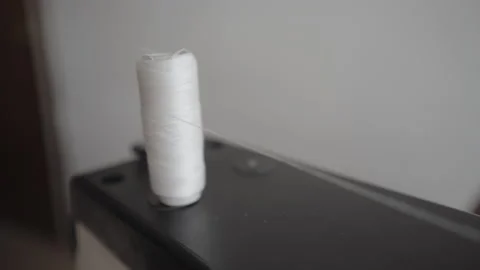 Sewing thread loop pulling out from machine Stock Footage 143495112