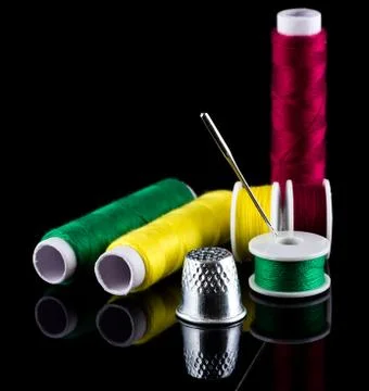 Sewing thread needle and thimble Stock Photos