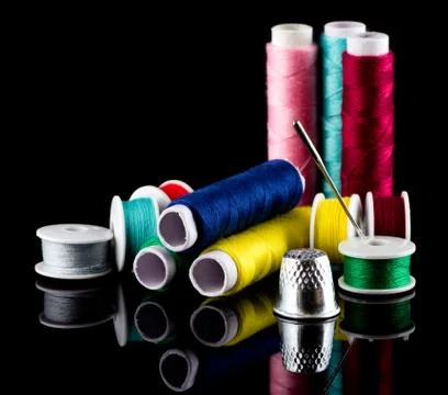Sewing thread needle and thimble Stock Photos