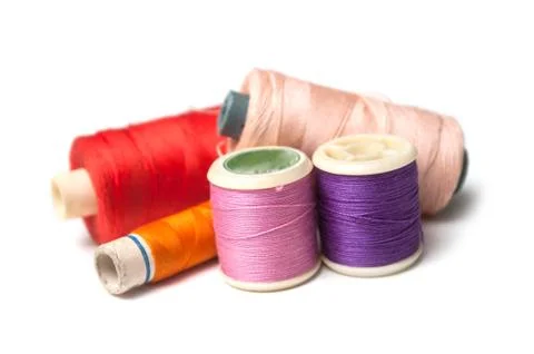 Sewing thread spool bobbins on white background Stock Photos