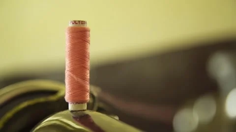 Sewing Thread Spool spinning close up Stock Footage