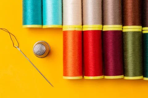 Sewing threads  and a needle thimble Stock Photos