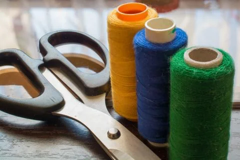 Sewing Threads and Scissors. Stock Photos