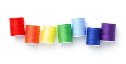 Sewing Threads Arranged Like Rainbow Colors Isolated Stock Photos