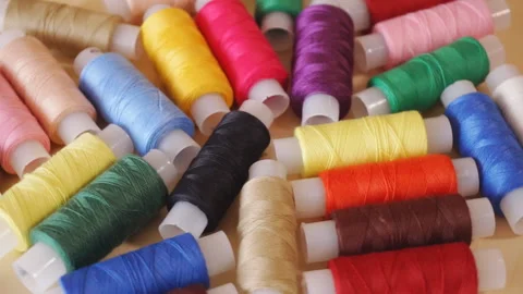 Sewing threads. Colorful thread spools used in fabric and textile industry Video stock 111058232