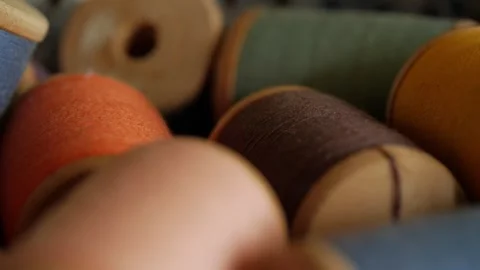 Sewing threads of different colors in rolls close-up 動画素材 281329272
