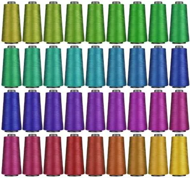 Sewing threads of different colors on a white background, isolated Stock Photos