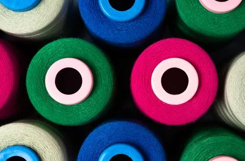 Sewing threads as a multicolored background close up. Stock Photos