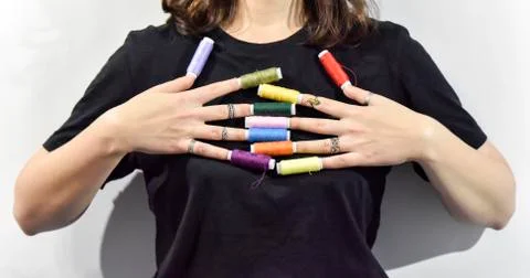 Sewing threads as a prolongation of fingers Stock Photos