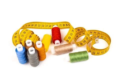 Sewing threads, sewing centimeter or measuring tape, isolated on white backgr Stock Photos