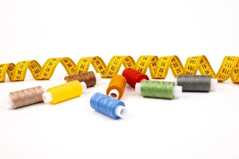 Sewing threads, sewing centimeter or measuring tape, isolated on white backgr Stock Photos